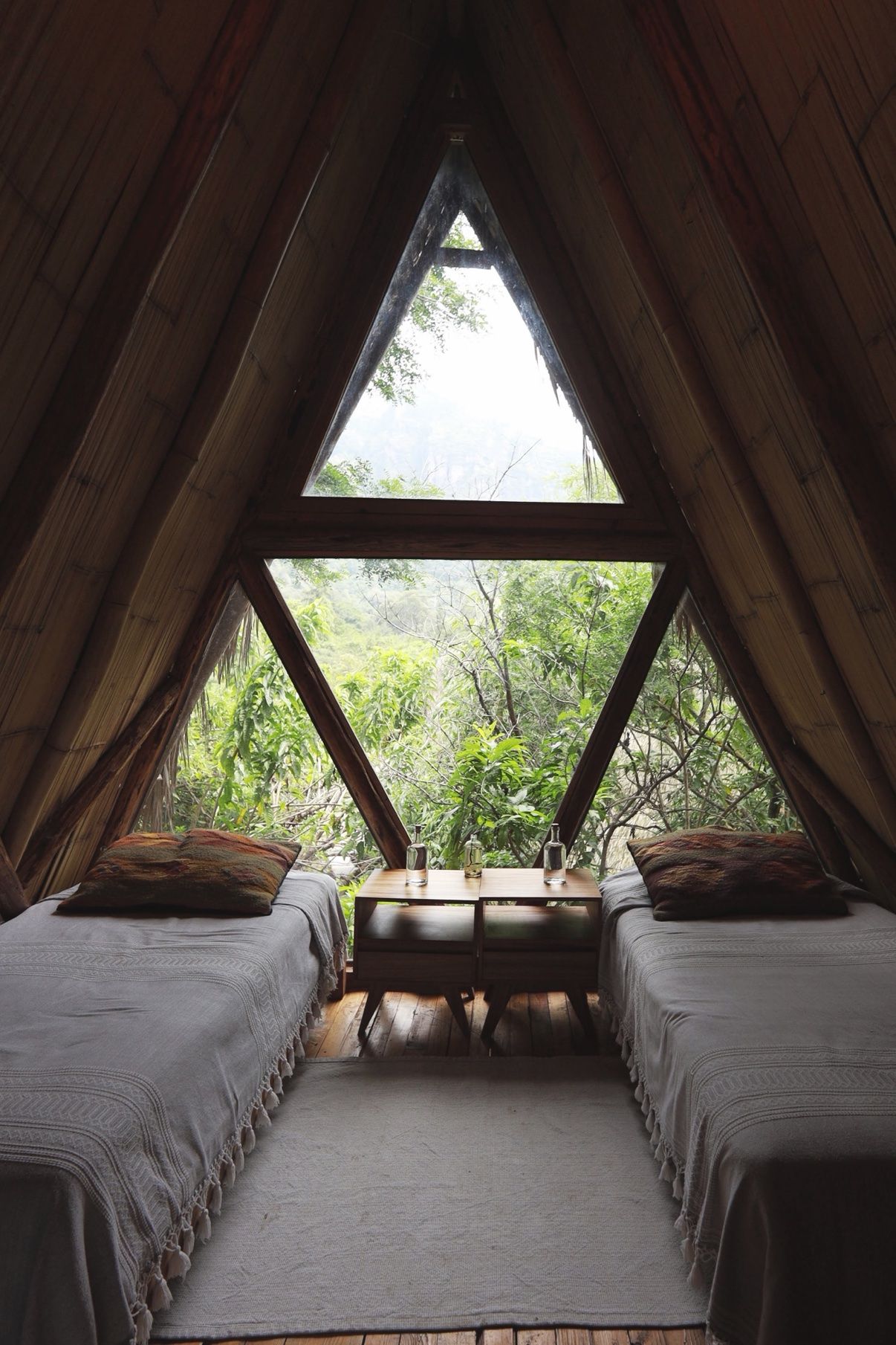 Safari tent twin beds under the triangular window