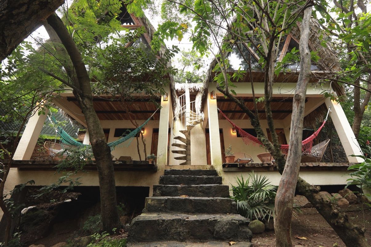 Safari tents among the trees with hammocks