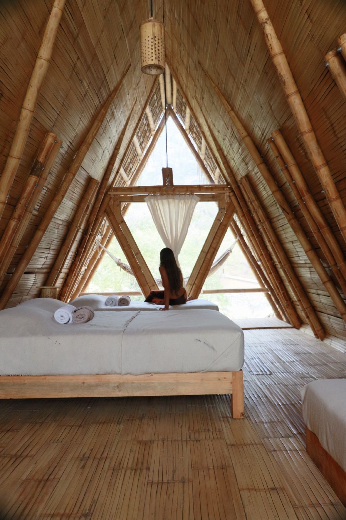 Inside the Safari Bali, beds under the bamboo A-frame